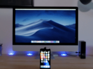 An animated gif showing a very smooth slide in shot of an iphone on a desk.